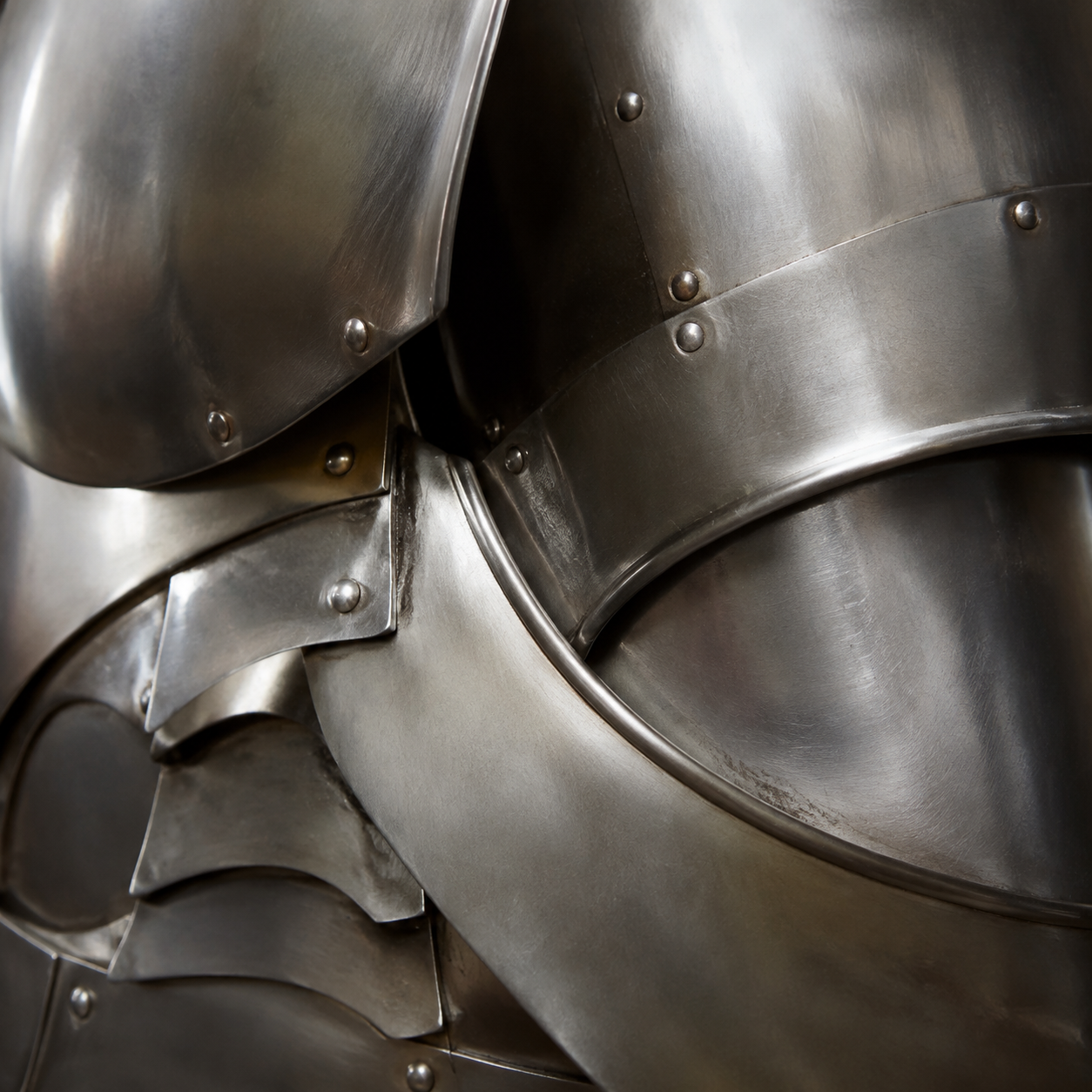 Close detail of overlapping polished steel armor plates