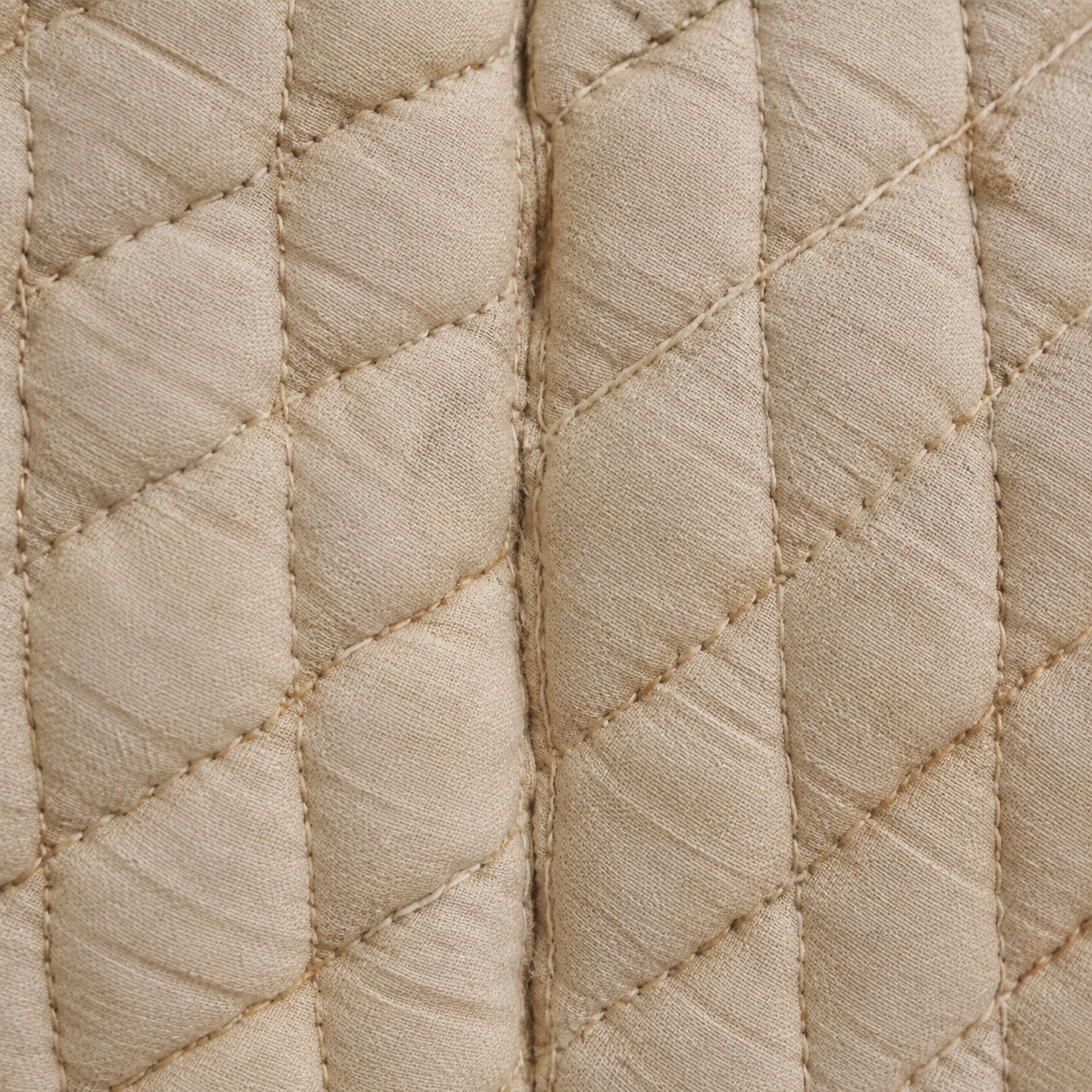 Close detail of layered, quilted textile padding
